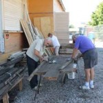 Al Harris, Diane Rook-Harris, Bob Miller salvaging flooring